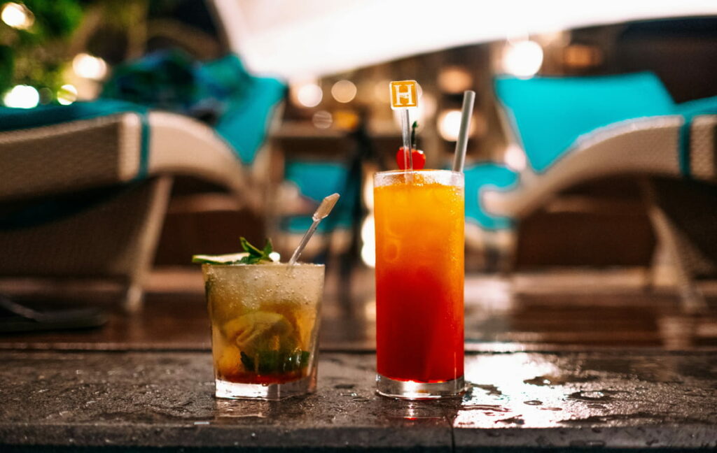 Cocktails sitting on a wet floor, ideal for sipping while waiting out the rain at the hotel