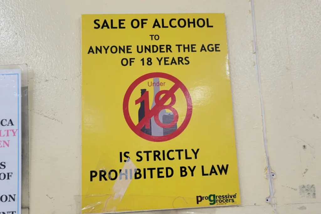 Sign in Jamaica stating that the sale of alcohol to anyone under 18 years old is prohibited by law