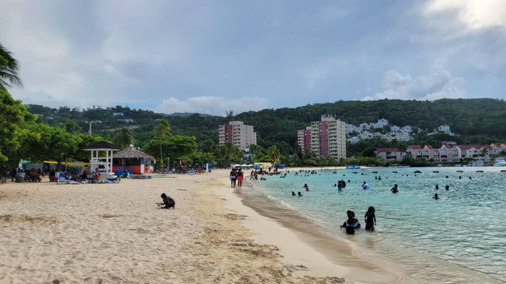 Ocho Rios, Jamaica beach filled with people soaking up the tropical atmosphere.