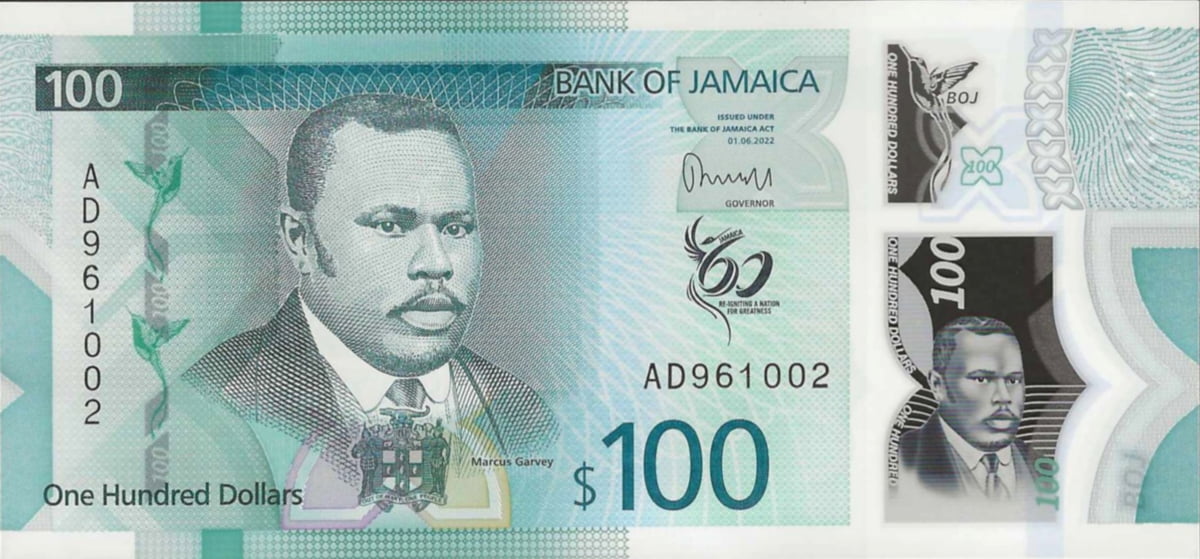 The green $100 Jamaican dollar banknote, a piece of Jamaican currency featuring Marcus Garvey.
